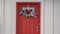 Clear Panorama Front door with glass panel and holiday decoration against a ribbed white wall