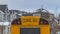 Clear Panorama Rear view of a yellow school bus with a window and several signal lights