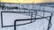 Clear Panorama Rope climbing frame and curving pathway with handrails on a park in winter