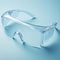 Clear protection Transparent polycarbonate safety glasses on pastel blue background