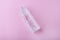 Clear pure Quartz chalcedony tower on pink background. Rhinestone