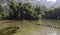 The clear river water and green bamboo forests