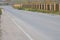 A clear road near a fence