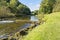 The clear, shallow River Lathkill in Lathkill Dale Derbyshire