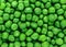 Clear and sharp close up view of fresh green peas background surface