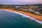 Clear skies aerial sunrise shorescape at the beach