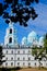 A clear sky with beautiful, white clouds above blue domes of the Transfiguration of Valaam Cathedral. Valaam is a cozy and