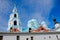 A clear sky with beautiful, white clouds above blue domes of the Transfiguration of Valaam Cathedral. Valaam is a cozy and