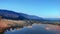 Clear sky with lake in the long mountains range