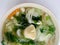 Clear Soup with Bean Curd , mix vegetable, Tofu and seaweed in white bowl on white background. Vegetarian Food, Healthy food, Thai