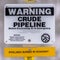 Clear Square Close up of a Warning sign on an area with crude pipeline viewed in winter