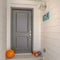 Clear Square Entryway of a home with a narrow passage way leading to the gray door