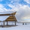 Clear Square Expansive landscape blanketed with snow under a cloudy blue sky in winter under