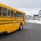 Clear Square Side view of a school bus on a road passing through snowy homes in winter