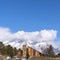 Clear Square Stunning home and lush trees against a magnificent snowy mountain in winter