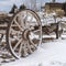 Clear Square Weathered wagon against a scenic landscape blanketed with snow in winter