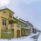 Clear Square Wet and snowy pathway in front of adorable homes in Daybreak Utah