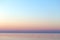 Clear sunset sky. Gradient background in pastel colors. Sunset over the sea.