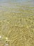 Clear transparent lake water sand beach