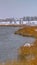 Clear Vertical Oquirrh lake with view of snowy lakefront homes