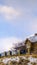 Clear Vertical Salt Lake City home on a snowy hill against sky