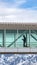 Clear Vertical Skybridge with a silhouette of a man seen through the clear glass wall