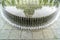 Clear water of circular pool fountain reflecting the Utah State Capital Building