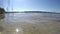 Clear water lake closeup. Light waves in the wind