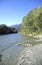 Clear water mountain river with forests and mountains