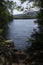 Clear water of Mountainview Lake, summertime, Sunapee, New Hampshire, vertical.