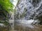 Clear water river rocky wall in Cheile Rametului