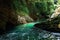 Clear water of the wild moutain river falling from the moss covered stones in the in Georgia