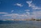 Clear waters of Mediterranean sea and a beautiful view of Aegina town in Aegina island, Saronic gulf, Greece