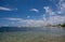 Clear waters of Mediterranean sea and a beautiful view of Aegina town in Aegina island, Saronic gulf, Greece