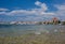 Clear waters of Mediterranean sea and a beautiful view of Aegina town in Aegina island, Saronic gulf, Greece
