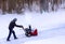 Clearing snow from a drivway using snowblower