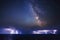 Clearly Milky Way galaxy at dark night sky space and thunderstorm on sea
