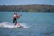 Clearwater, FL- March 12- Kite surfer slides along the water watching his kite on March 12, 2016