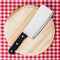 Cleaver on wooden chopping board