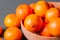 clementine mandarin fruit. mandarins in the wooden bowl