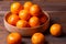 clementine mandarin fruit. mandarins in the wooden bowl