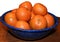 Clementine oranges in enamel blue bowl