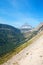 CLEMENTS MOUNTAIN AT THE TOP OF LOGAN PASS ON THE GOING TO THE SUN HIGHWAY UNDER CIRRUS CLOUDS IN GLACIER NATIONAL PARK USA