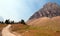 CLEMENTS MOUNTAIN TOWERING ABOVE HIDDEN LAKE HIKING TRAIL ON LOGAN PASS DURING 2017 FALL FIRES IN GLACIER NATIONAL PARK MONTANA US