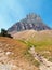 CLEMENTS MOUNTAIN TOWERING ABOVE HIDDEN LAKE HIKING TRAIL ON LOGAN PASS DURING 2017 FALL FIRES IN GLACIER NATIONAL PARK MONTANA US