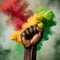 Clenched Fist in an African Hand Amidst Red, Yellow, and Green Smoke