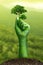 Clenched fist hand, raised fist - symbol of victory, Stranglehold by nature and trees, Environment earth day,Concept Save the