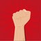 Clenched fist held high vector on red radius