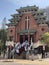 Clergyman preparing to enter a Chinese style church in Christmas Day