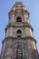 Clerigos Tower in Porto bottom view. Famous tower with clock and bell in Porto. Religious architecture concept.